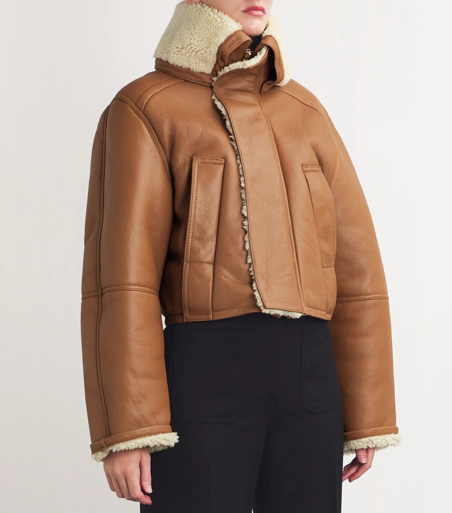 Elegant women's leather jacket displayed on a mannequin, featuring a sleek cut and premium craftsmanship.