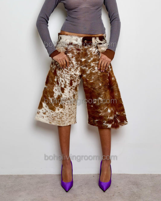 Stand out with real cowhide long shorts for women in a bold brown and white pattern. Perfect for western weddings, rodeo styling, and southern country events.