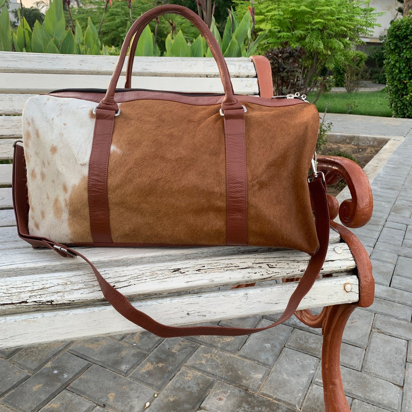 Make a statement with this cowhide overnight bag, your symbol of sophisticated travel.
