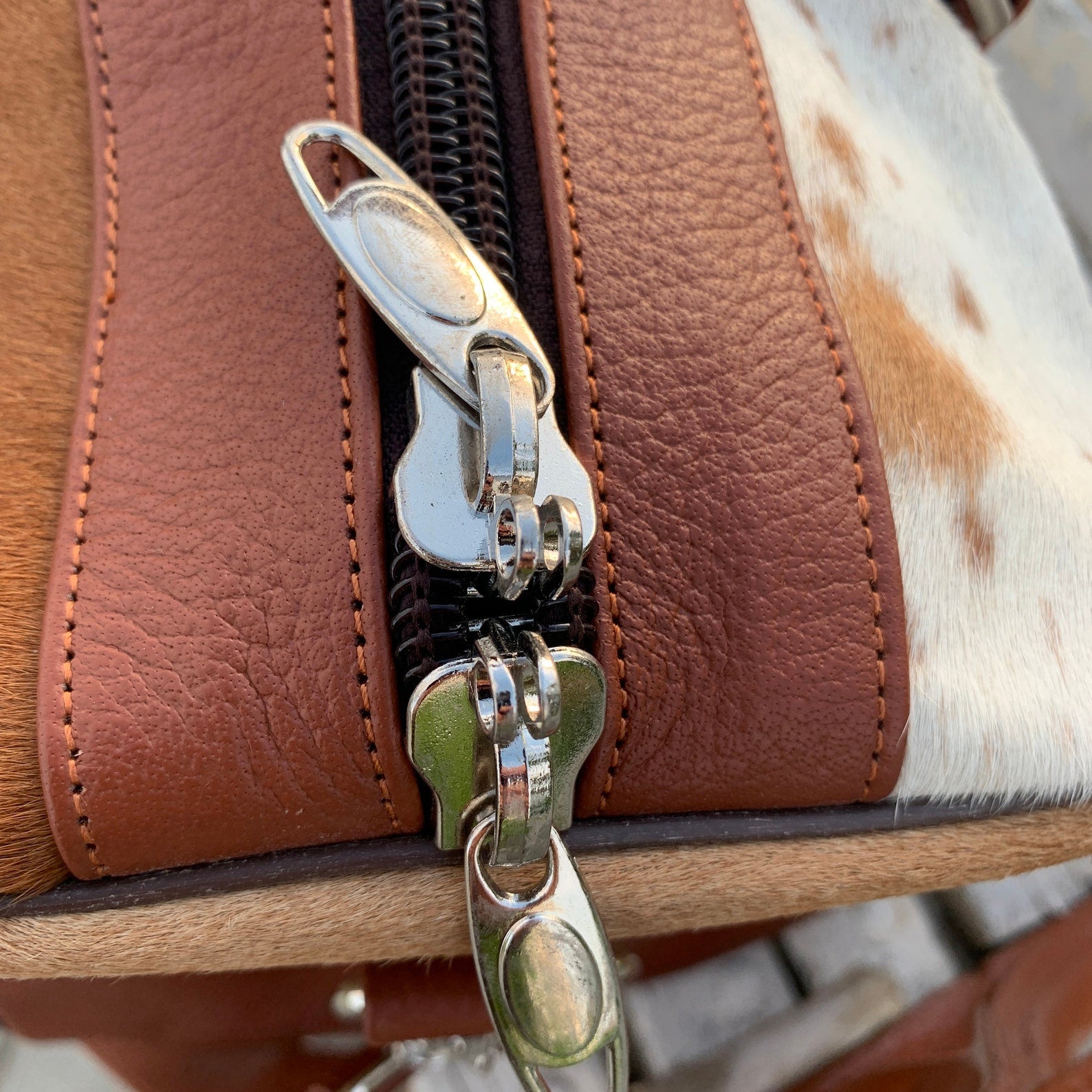 Embrace adventure with a cow hide duffle bag, a fusion of rugged charm and urban sophistication for your travels.