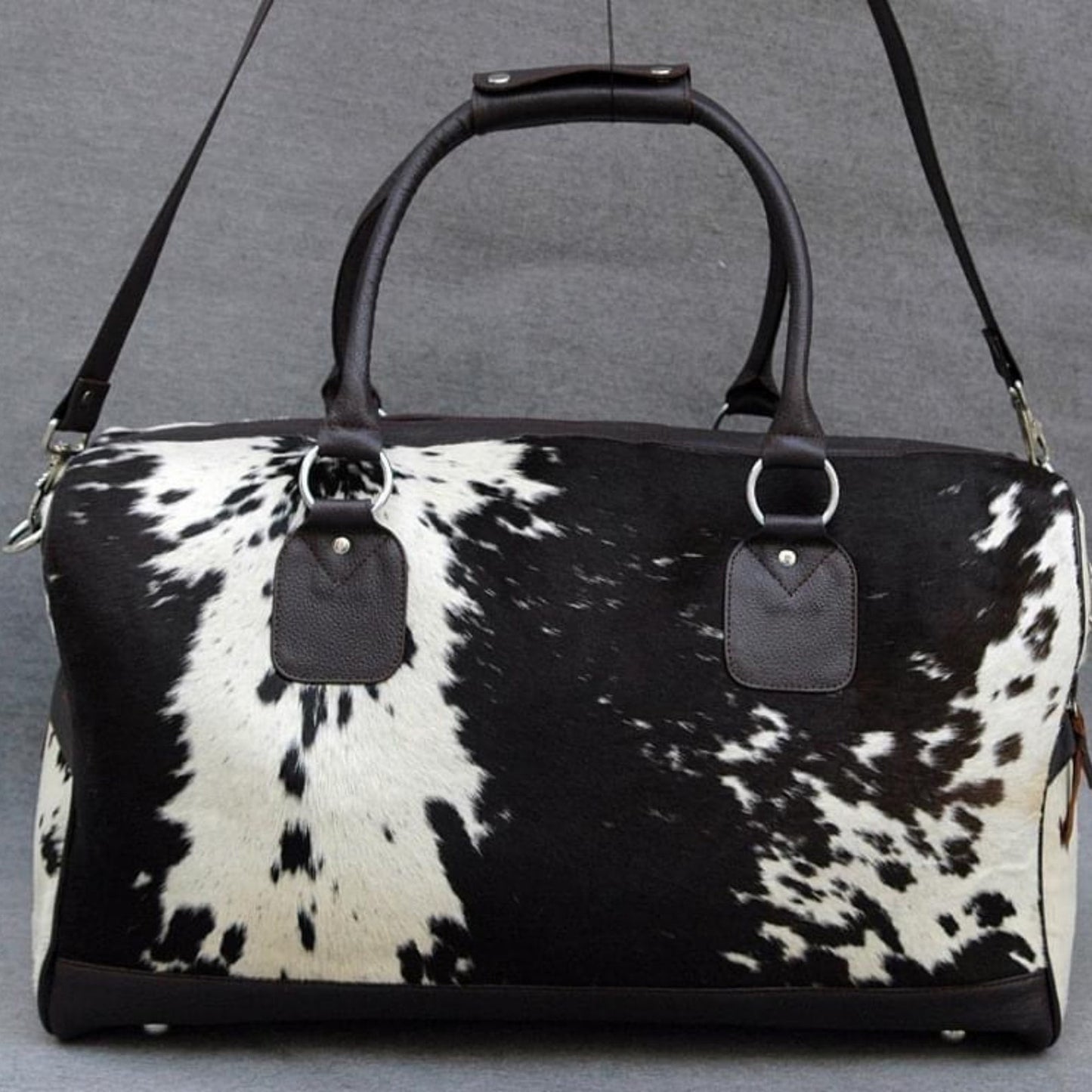 Set forth in style with a premium cow hide duffle bag, blending rugged durability with timeless elegance.