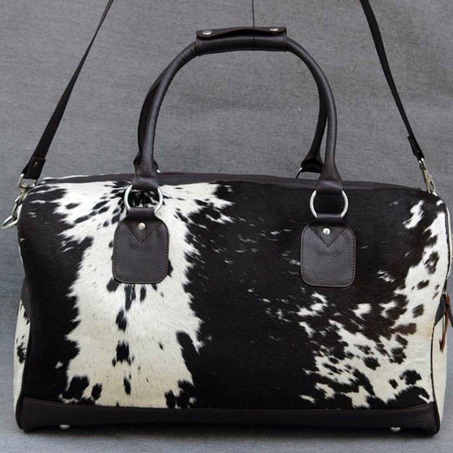 Set forth in style with a premium cow hide duffle bag, blending rugged durability with timeless elegance.