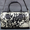 Travel in opulence with a refined cow fur overnight bag, your essential companion for indulgent adventures.