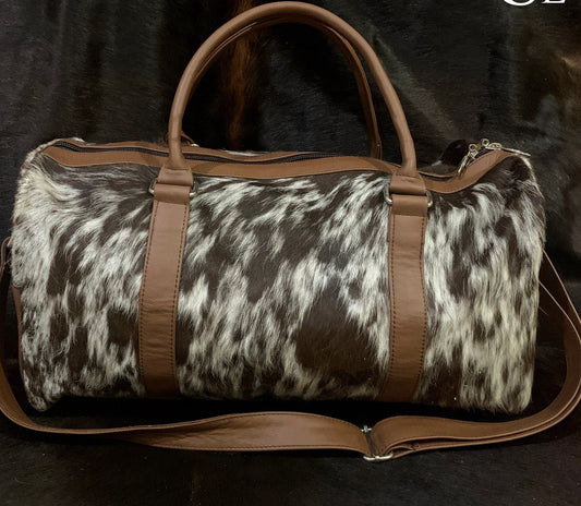 Cow skin travel bag: sleek design, spacious and reliable, perfect for adventures.