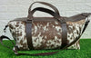 Make a stylish statement with this exotic cowhide travel bag! Roomy and luxurious, it is perfect for carrying all your essentials in style.