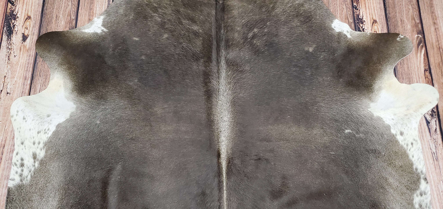 how to decorate with cow hide rug