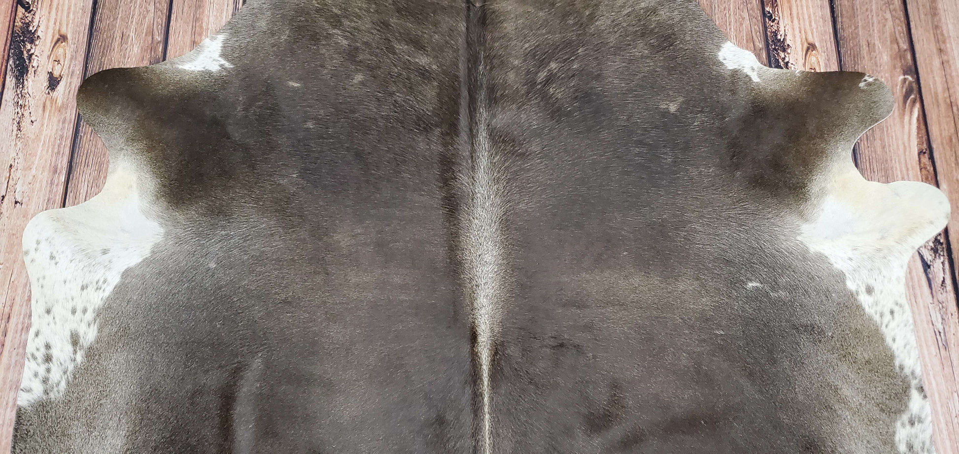 how to decorate with cow hide rug
