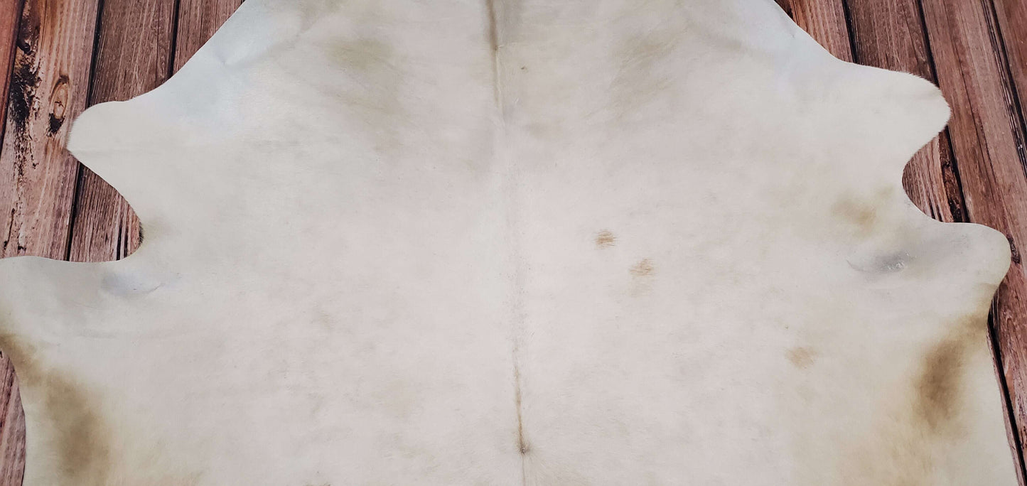 Beige And White Cowhide Rug