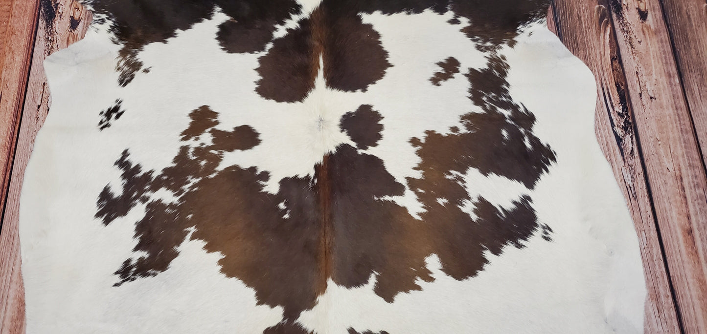 brown white cowhide rug