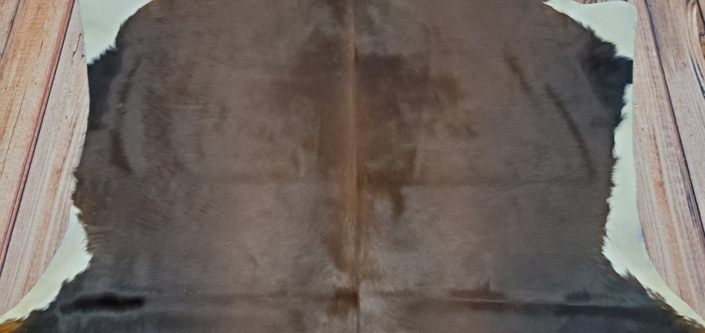 Add this cowhide rug in ranch house.