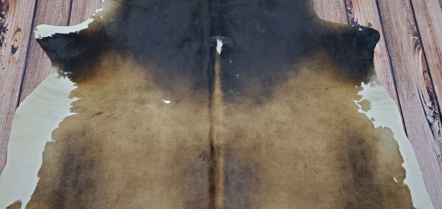 Add the perfect touch to your space with a natural cowhide rug! These stunning rugs come in brown and white, adding style and texture to any room.