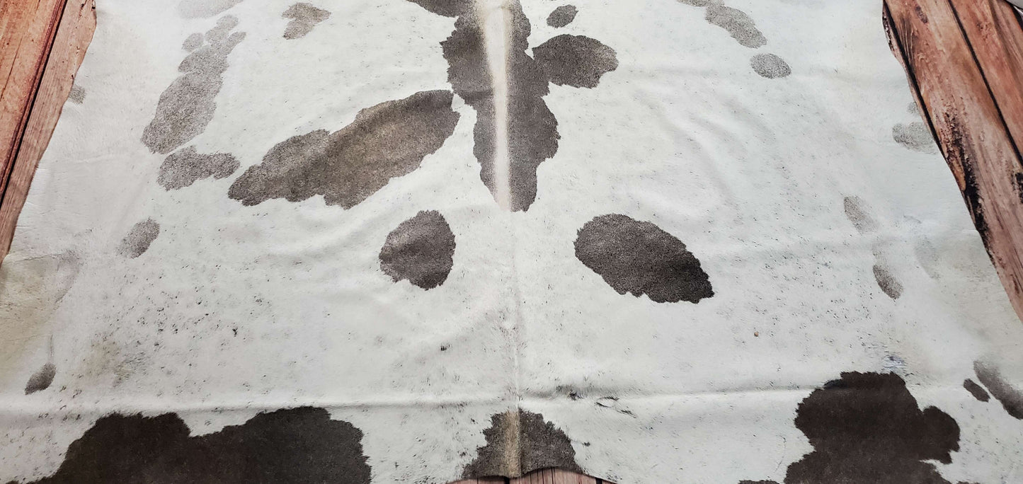 You will receive the large, real and natural grey cowhide rug shown in the picture, hand picked for unique and exotic patterns. This cowhide rug with grey couch will look beautiful, a one of its kind touch.