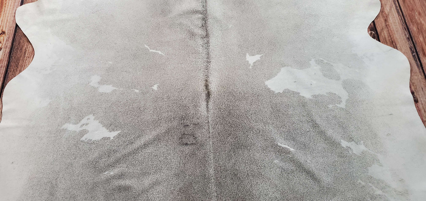 Only this one cowhide rug is breathtaking, unique spotted gray and white pattern