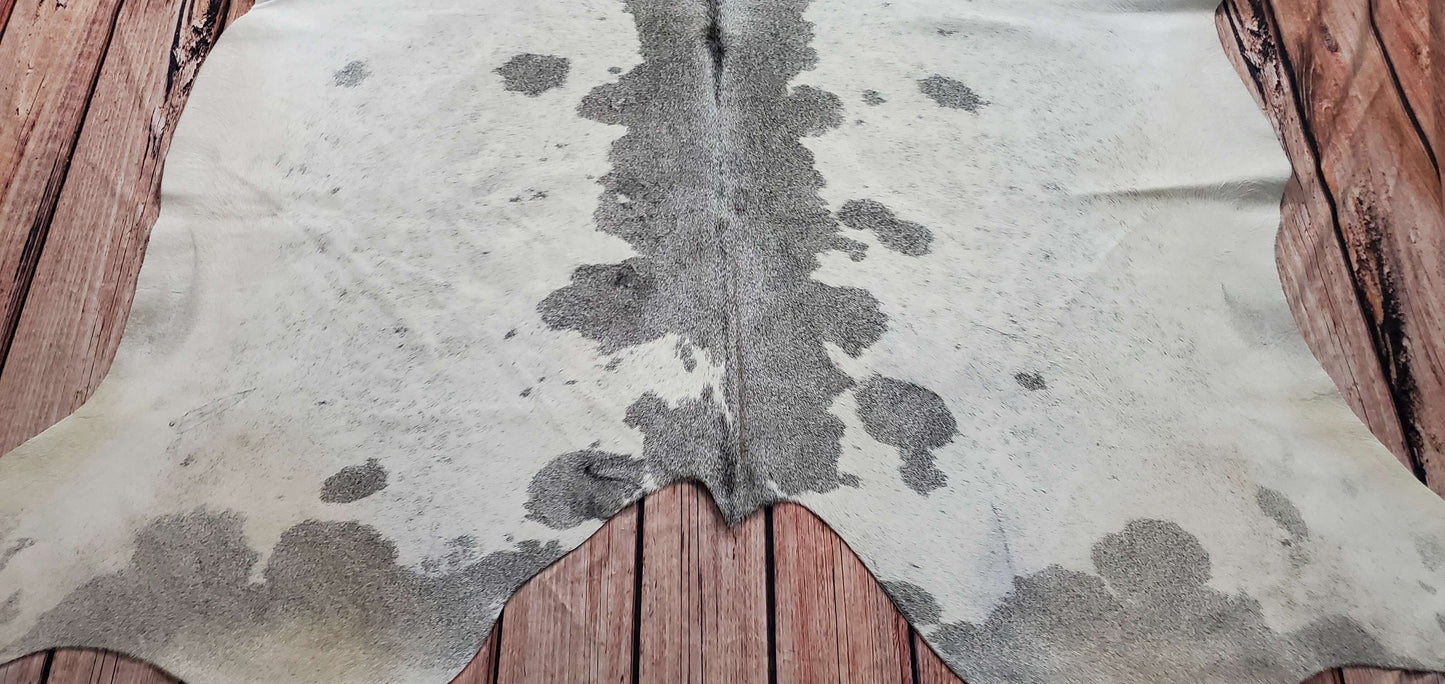 A dark grey cowhide rug is the ideal in any room to blend, natural, real and free shipping all over the USA.