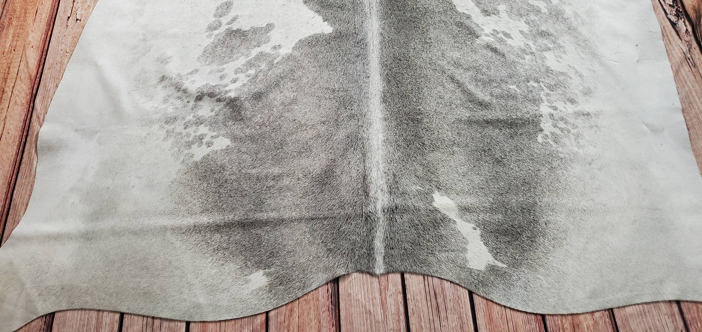 Light grey white cowhide rug is the perfect combination for an attention catching, looks marvellous anywhere in the house but especially entryway or hallway, it gives a striking feature also its free shipping all over the USA.