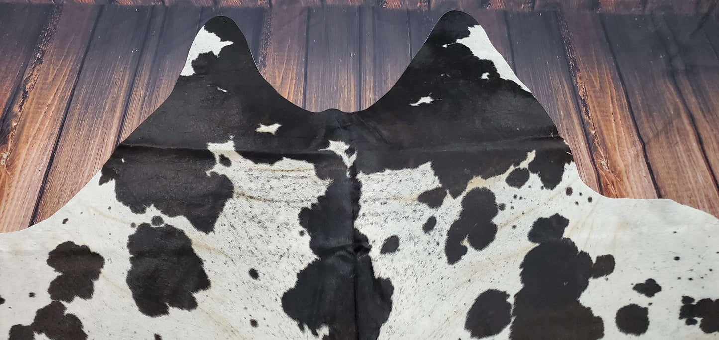 This speckled cowhide rug is so wonderful! It's so soft and plush. It's much more beautiful in person, primarily black with some white, and it goes with any room furniture perfectly.