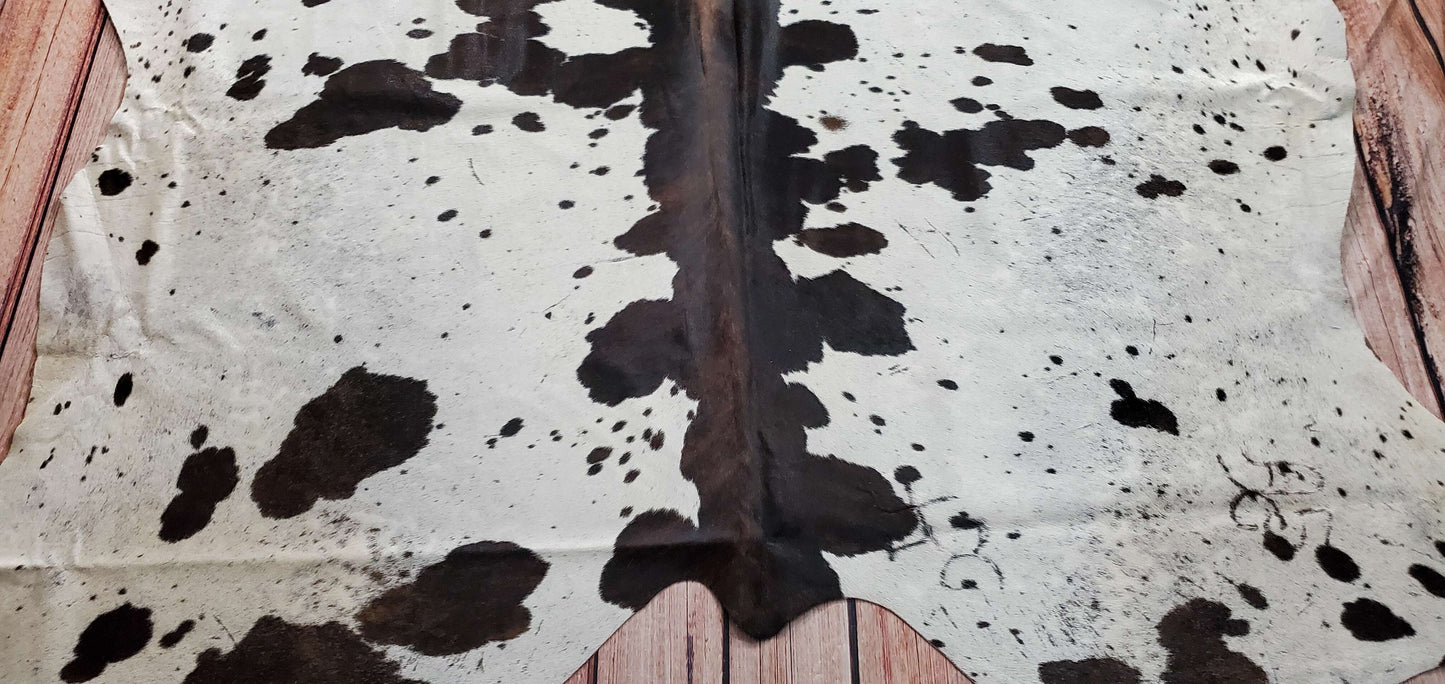 This lavishly speckled cowhide rug is so pretty and soft. It looks so much prettier than it did online, its predominately black with just a little bit of white, and it matches any furniture piece seamlessly.