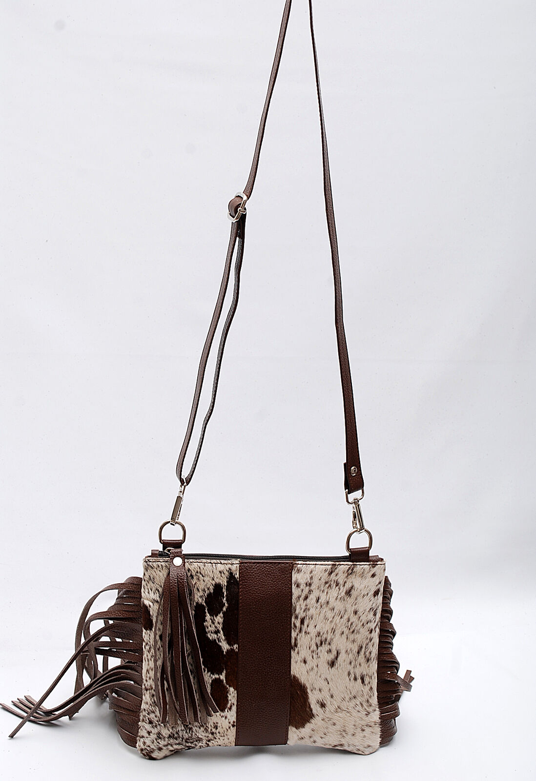 This medium size cowhide purse makes it a great option for carrying items when you’re out and about, whether you’re running errands or just hanging out with friends.