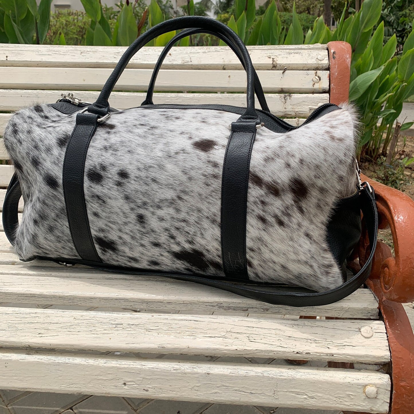 Experience the allure of adventure with this cowhide overnight bag, crafted to accompany you on every expedition.