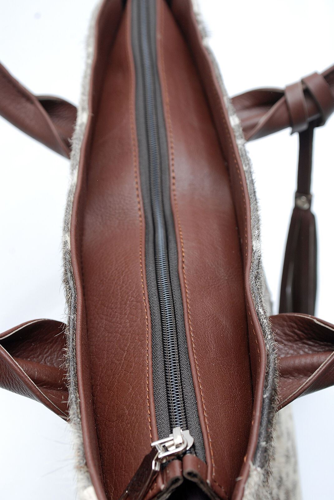 With the recent resurgence of vintage style, the cowhide bag in tote style has become a popular item for fashion-savvy individuals.