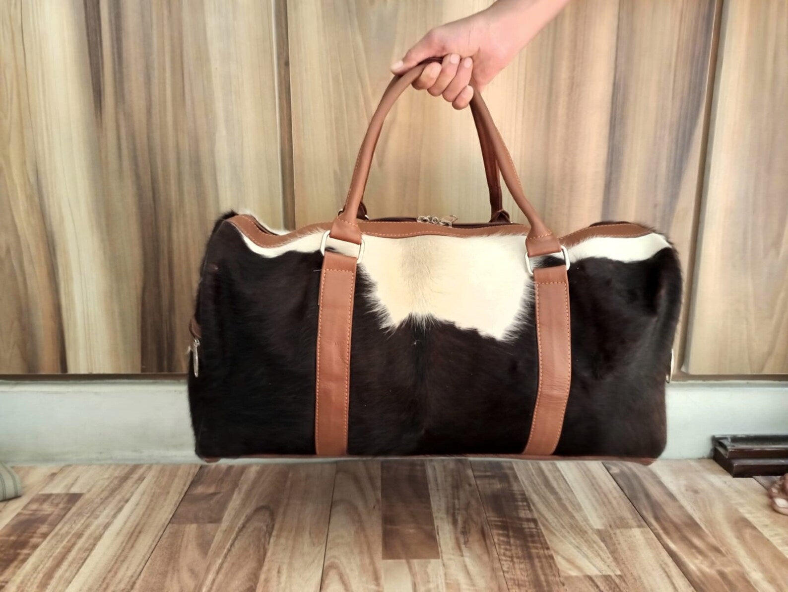 Hit the gym in style with this cow skin gym bag, your essential companion for fitness.