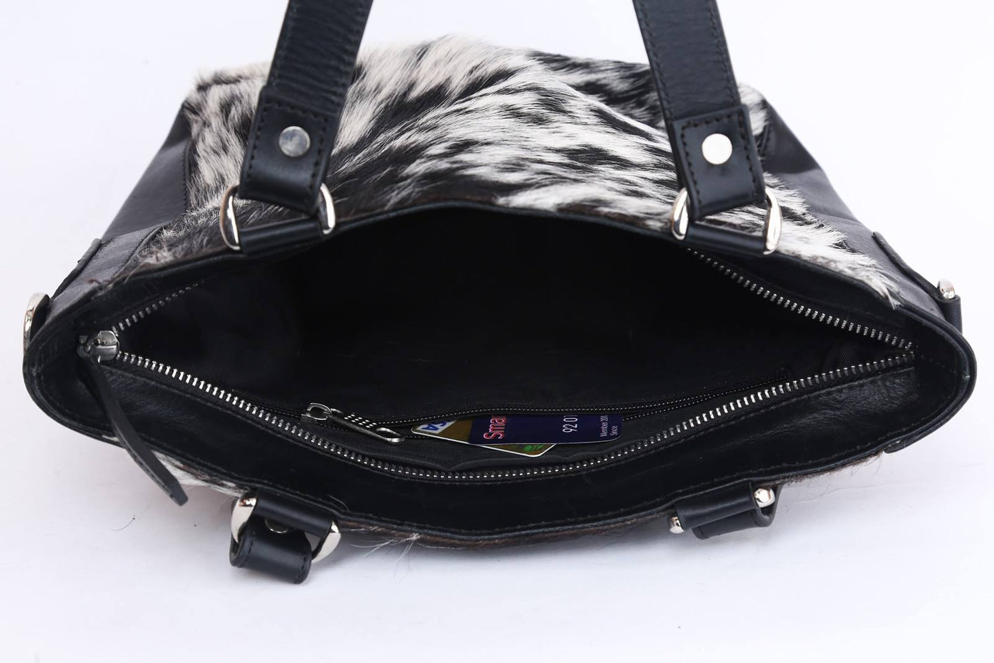black and white cowhide bag