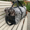 Venture forth with this cowhide travel bag, a testament to your wanderlust and appreciation for timeless craftsmanship.