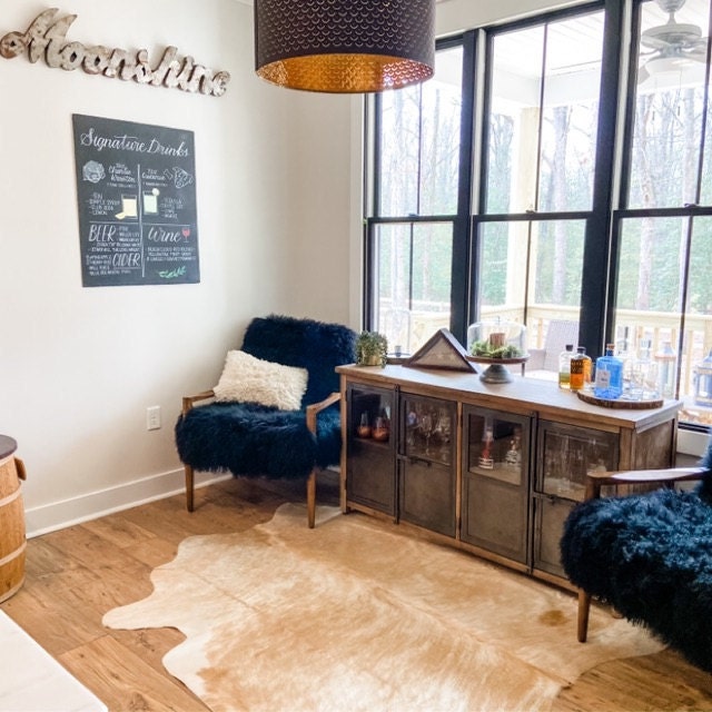 Crafted with the highest standards of quality and care, our cowhide rugs are the perfect addition to any space. Not only do they add warmth and texture to your floors, but they also make stunning wall hangings or furniture throws.