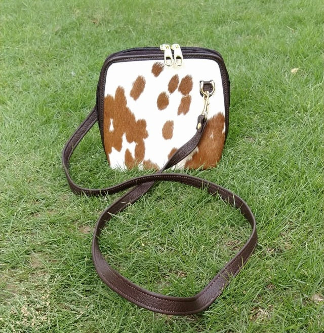Stylish and practical, this cowhide crossbody bag is a must-have for any woman on the go. This season, cowhide is the material of choice for stylish women everywhere.