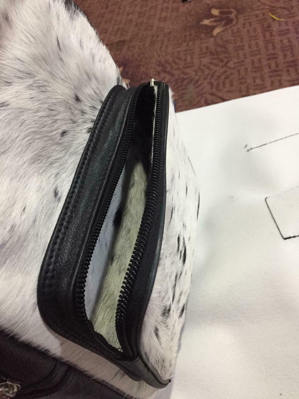 If you are still on the fence about getting a western bag this real cowhide handbag is custom made, unique and very high quality and great for travel