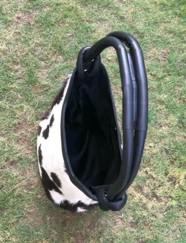This is the real cowhide bag in tote style, perfect with leather strpas and big enough for daily use, this bag stands well against other major brands