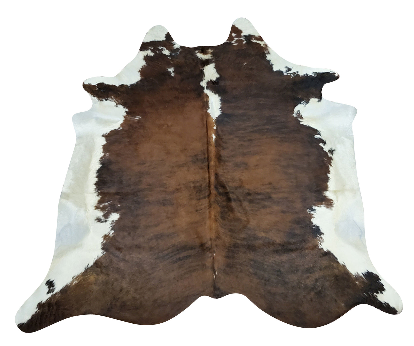 This beautiful cowhide rug is great for kids room in a farmhouse, the brown and white with some black is stunning, there is no folds or creases.