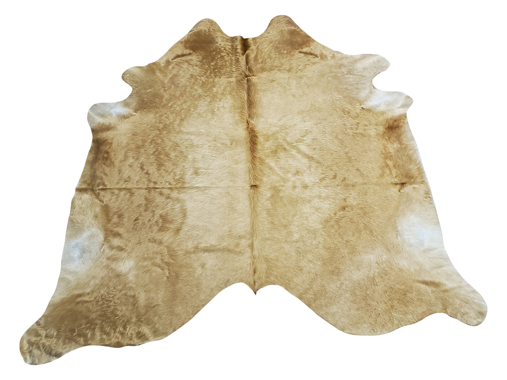 A cowhide rug can add a touch of luxury to any room, these champagne beige have a natural, exotic pattern that is unique, great for neutral spaces like living rooms and bedrooms, and can even be used for homestaging. 