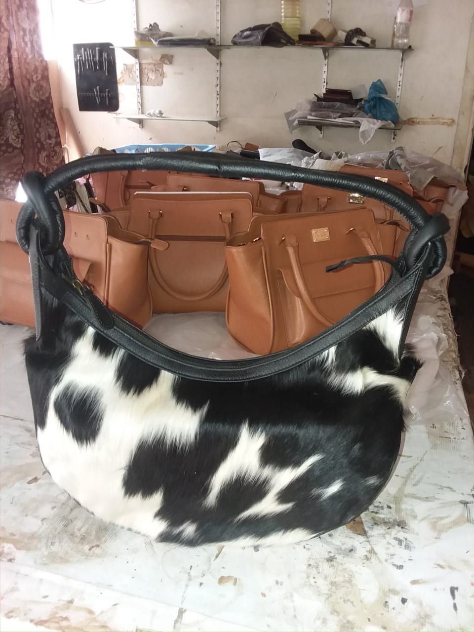 black white cowhide half moon bag