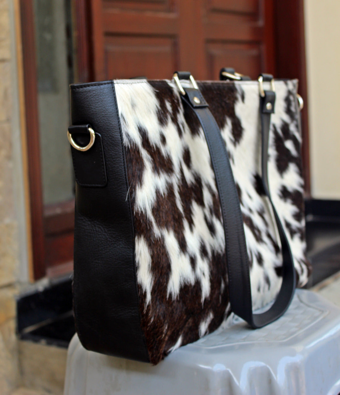 cowhide leather messenger bag dark brown and white