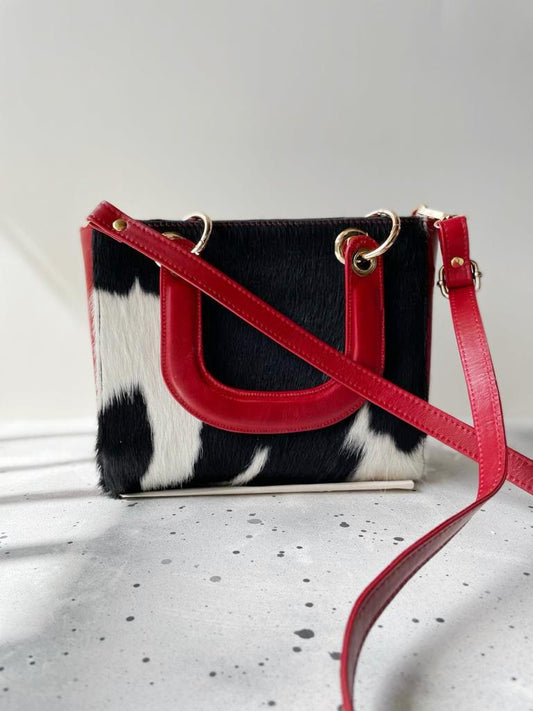 The quality of this natural cowhide bucket bag is awesome, the zippers are smooth and durable. The leather itself is thick and beautifully pebbled.