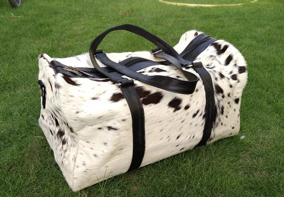 Elevate your travels with our cow skin overnight bag, a sleek and sturdy option for your journeys.
