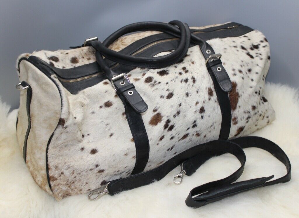 If you are searching for over sized cowhide travel bag this is perfect for laptop or shopper, its free fast shipping and made from cow fur.