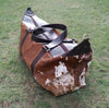 A leather luggage bag made from real hair on cowhide or cow hair very soft and smooth with furry feeling, these western cowhide bags are designer style.