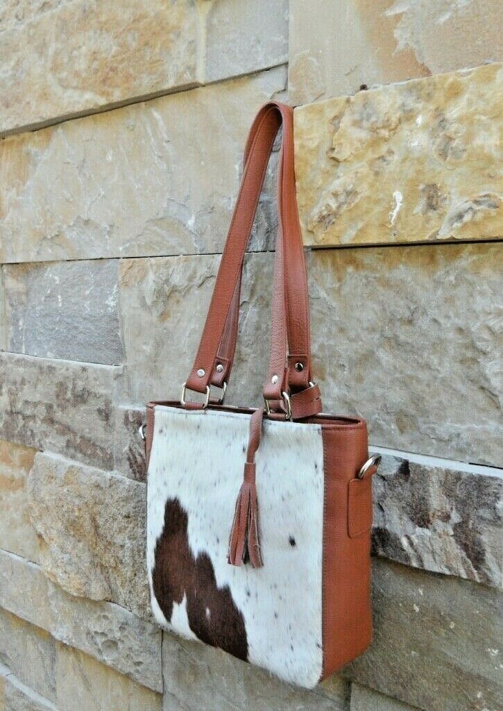 Each cowhide bag is made from real cow skin and shade varies from purses to purses.