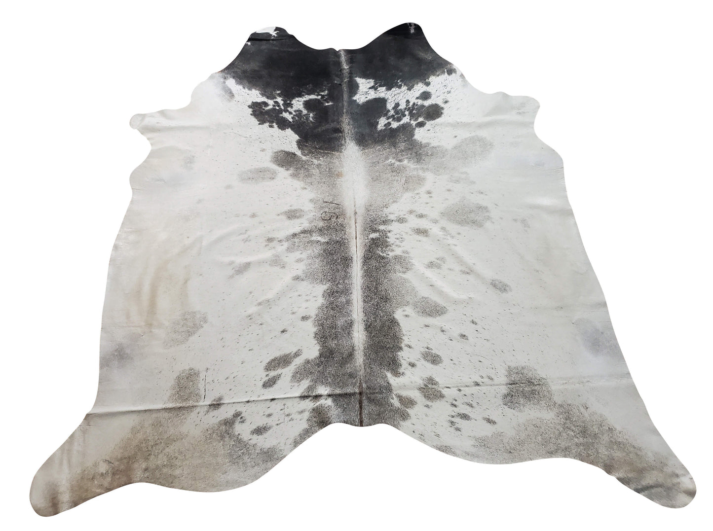 This grey and white cowhide rug features a western touch and will give your decor a rustic look, its one of a kind and markings are truly unique. 