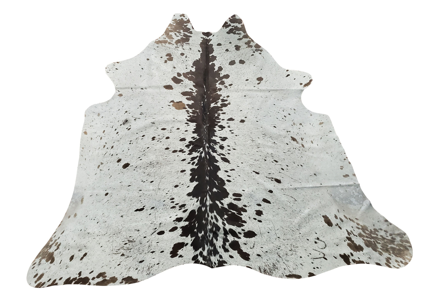 One of its kind, hand-picked and individually selected, this beautiful grey, black and white cowhide rug is a mix of mostly spotted black and white.