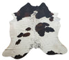 A brown and white cowhide can look stunning over top of area rugs, we are the best place to buy real hides with over hundreds of natural patterns 