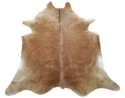 Adding a large solid brown cowhide rug to your home is a great way to make it feel warm, comfortable and inviting. This type of rug provides an organic look and can be used in any room in the house.