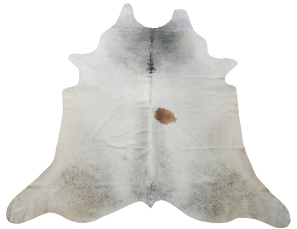 A cowhide rug with a beautiful combo of tan and white with pop of dark edges, cowhide will brighten up your room and make it feel lovely