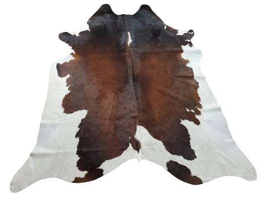 In any farmhouse style living room, a brown black cowhide rug is the perfect way to add a touch of rustic elegance, it will end up giving a stylish touch to any space of the home.