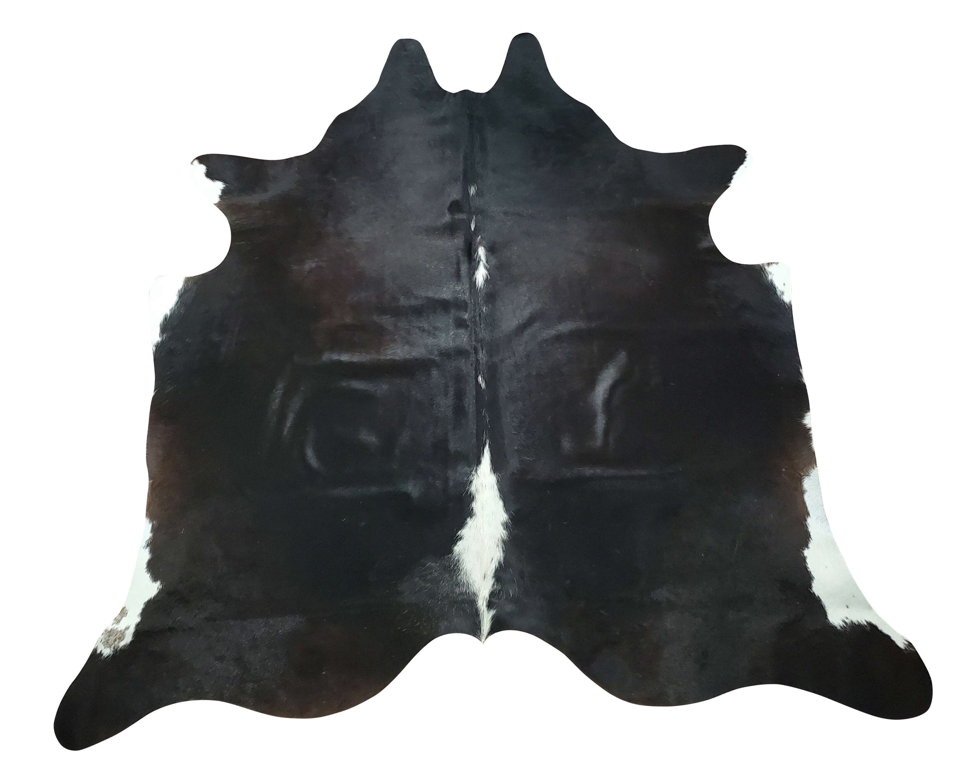 When it comes to unique home décor, there's nothing quite like a mini cowhide rug. And this natural black and white cowhide rug is the perfect way to add a touch of luxury to any space.