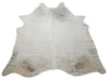 A beautiful cowhide rug for your family room cozies your room and feels great under feet, it is a mix of light tan and natural with free shipping USA. A tan cowhide rug brings a touch of exotic nature and rodeo culture to your house, these real cowhide rugs are hand finished for durability and comfort