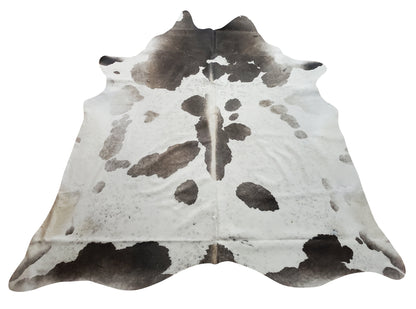  Grey white cowhide rug is great investment to hide the small problems of the living room, it can match easily with hardwood floors or entryway or even on the wall