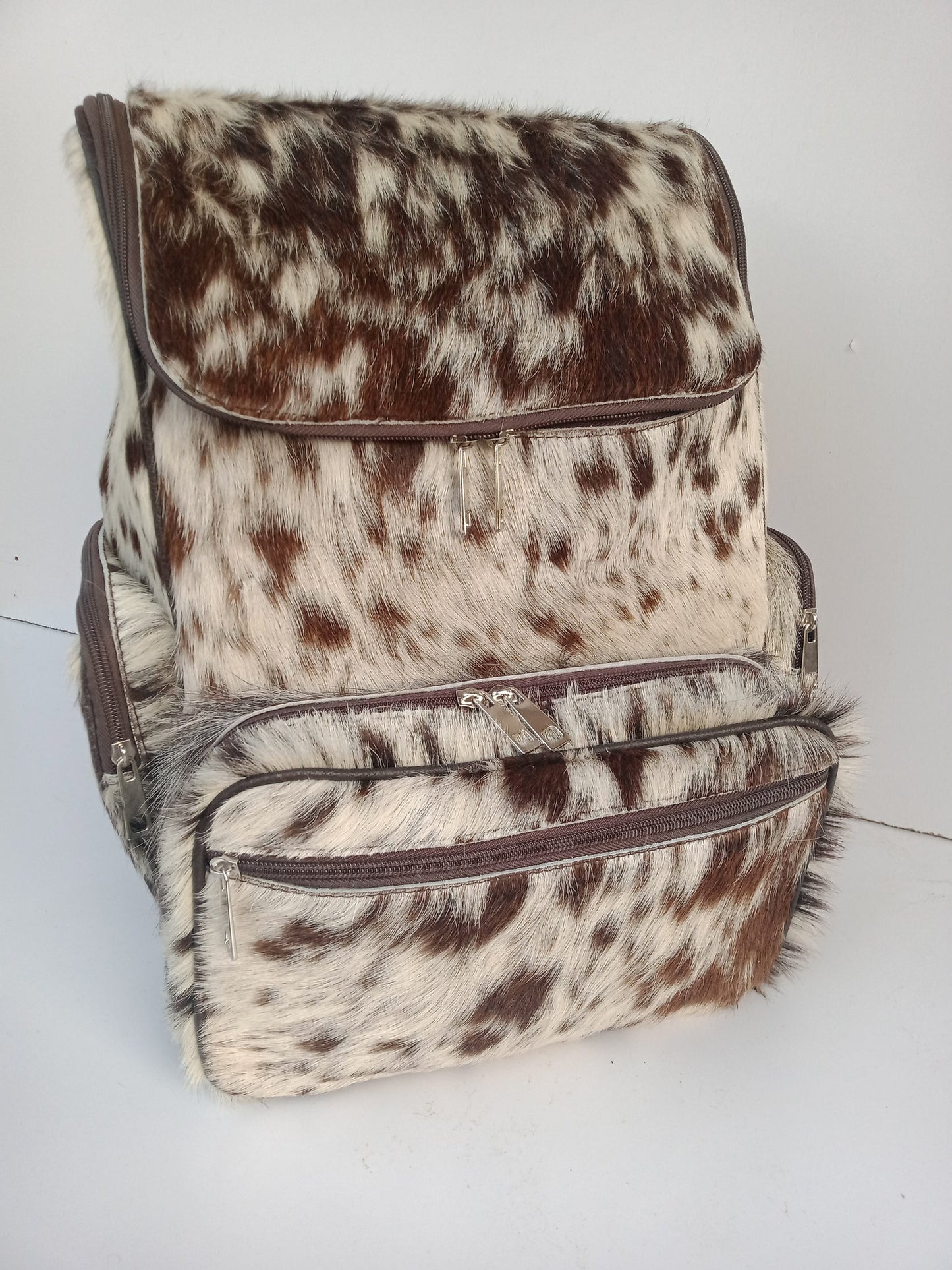 A cowhide mommy backpack is not only stylish, but it is also durable and functional. It can easily hold all of your belongings, including your laptop, diapers, wipes, and extra clothes for your little one.